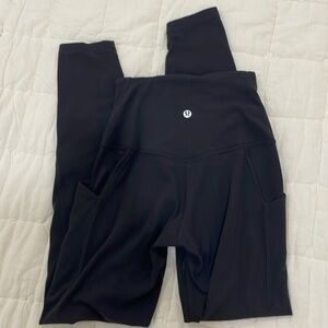 lululemon black leggings with side pockets! size2: SMALL FABRIC DEFECT IN LEG